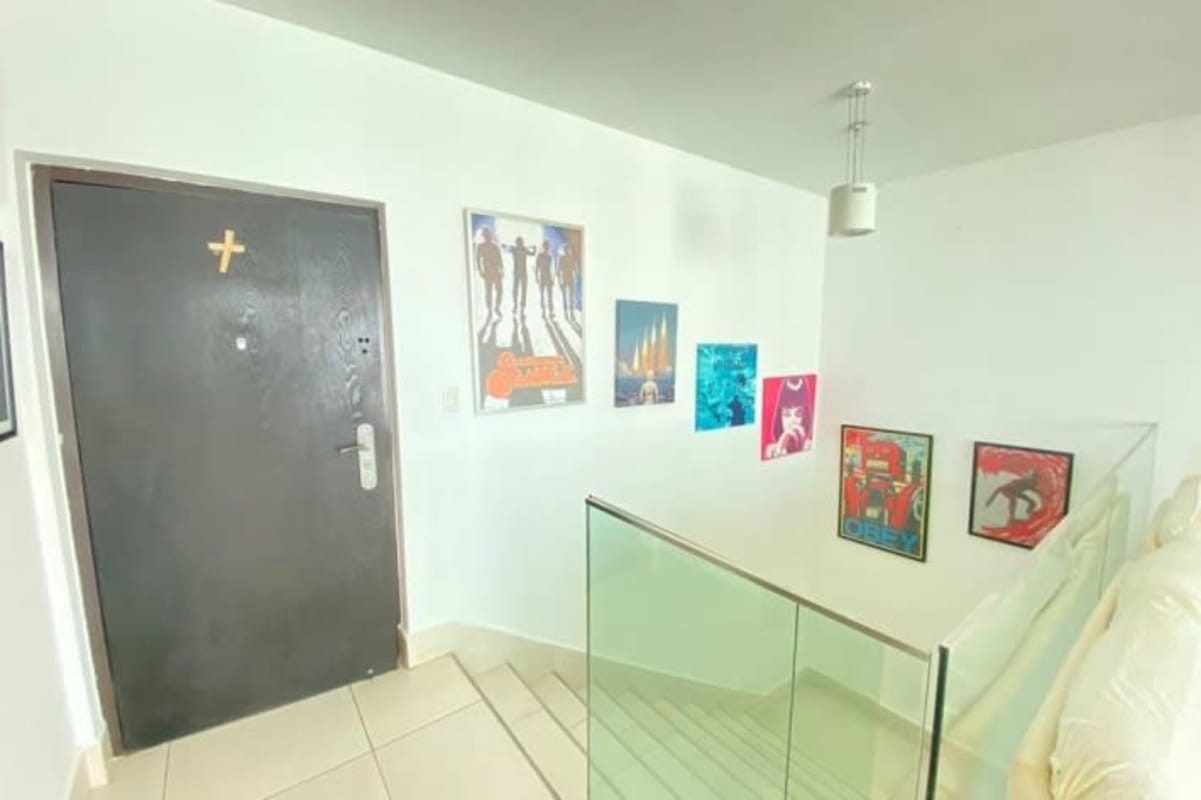 Clean bright corridor with stainless elevators in Costa del Este luxury apartment tower PH Rivage