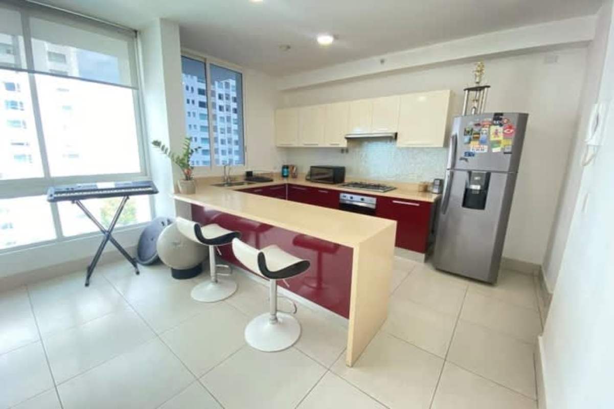 Contemporary kitchen with breakfast bar, large windows, stainless appliances in Panama Costa del Este
