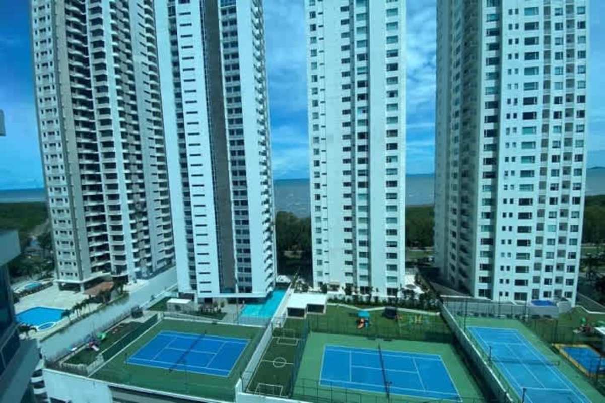 Aerial common area view showing tennis courts and pools in Costa del Este PH Rivage tower Panama