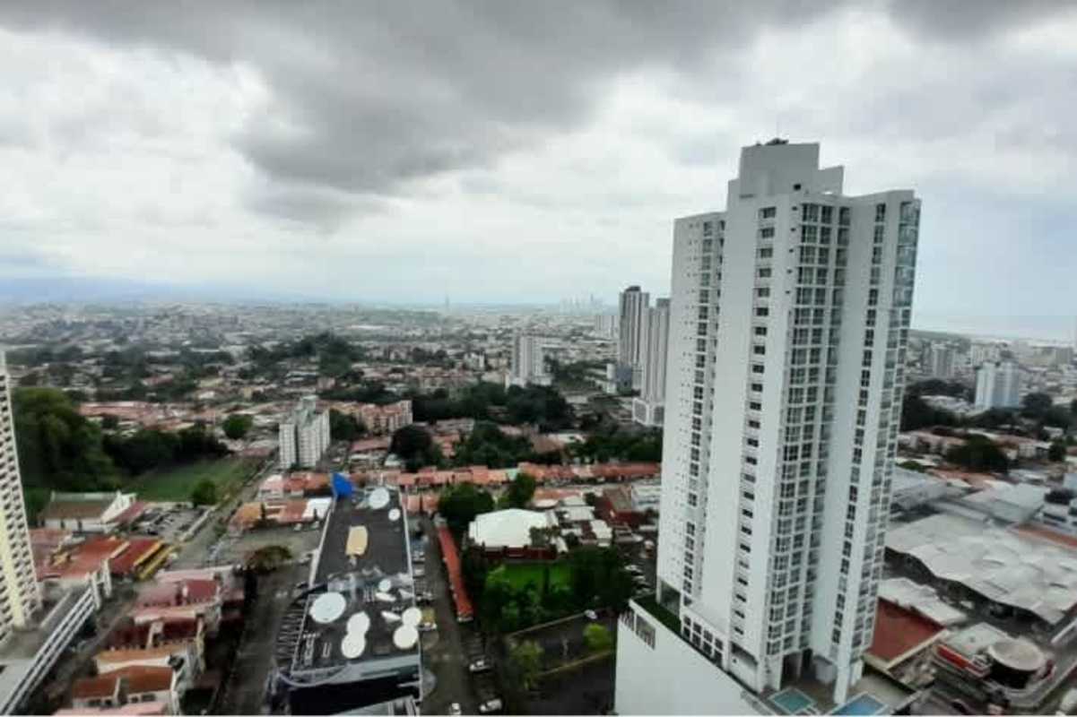 Aerial shot showing PH Vista Real high-rise and dense urban skyline in La Loma Hato Pintado Panama