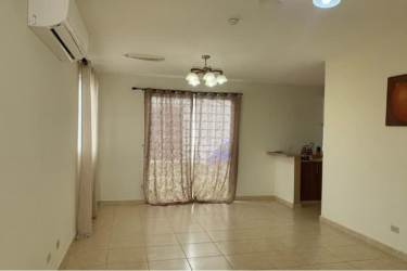 Open-plan living and dining area with tiled floors in house at Arboledas Los Castaños La Chorrera Panama