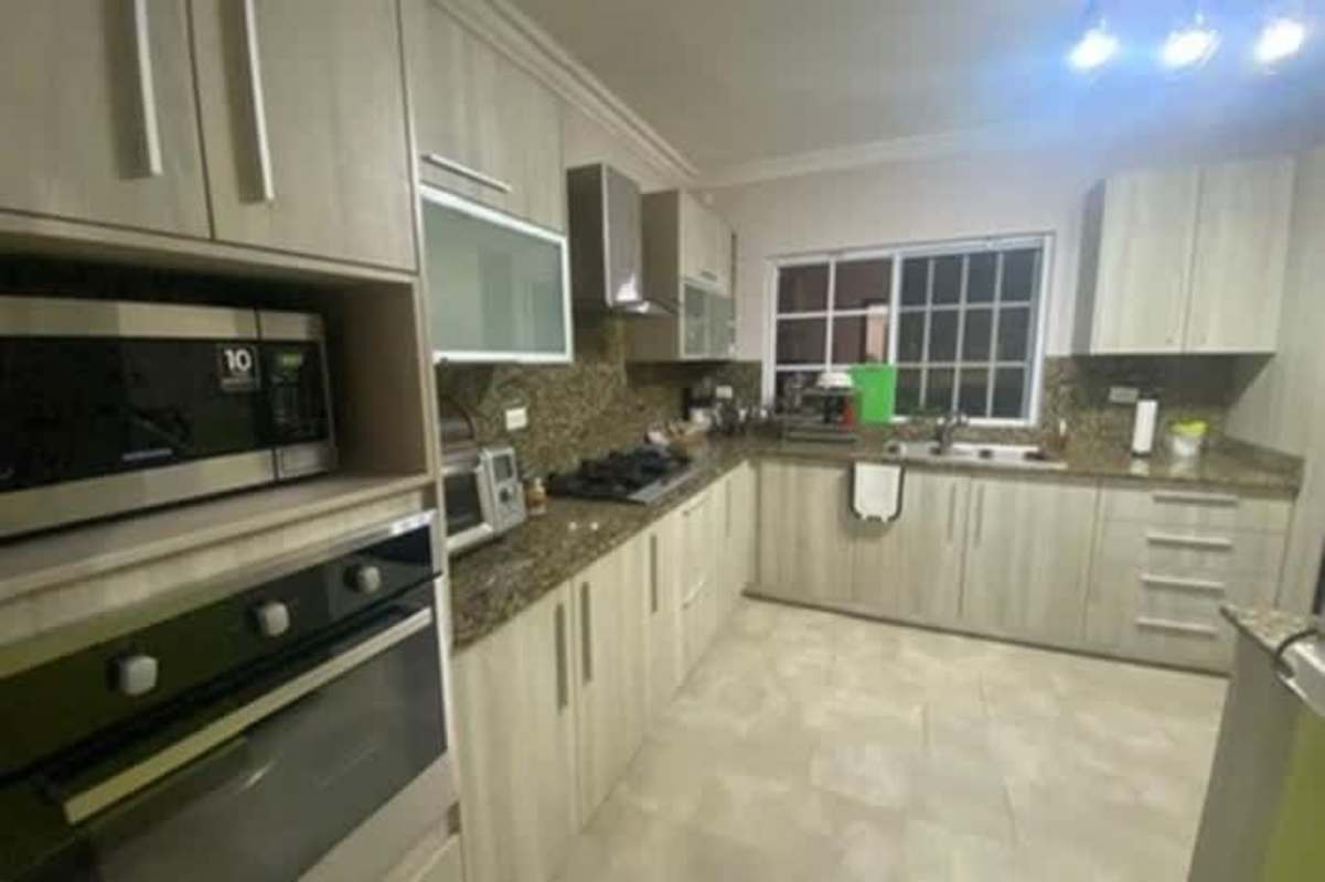 Outdoor pool and jacuzzi with covered patio in Altos de Panamá