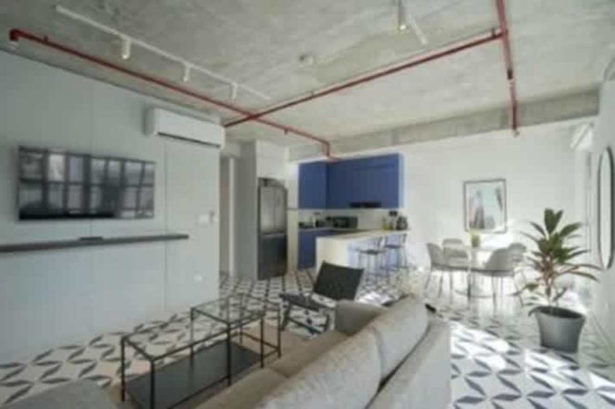 Modern industrial style apartment with exposed concrete ceiling and open-plan kitchen in Casco Viejo Panama