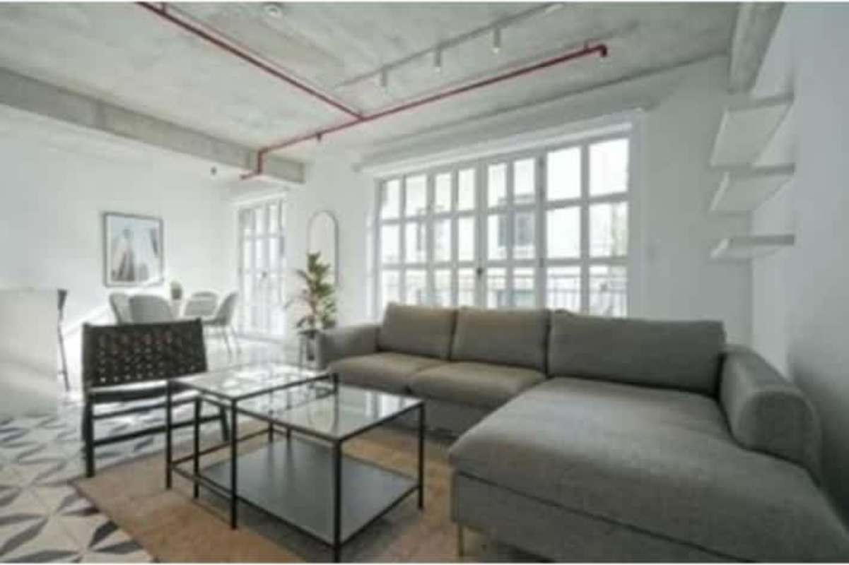 Outdoor patio with Mediterranean tiles, glass doors, lounge chairs Casco Viejo Panama