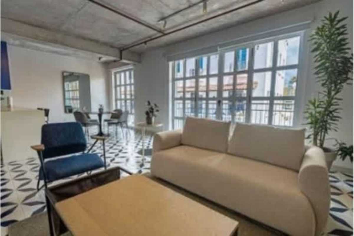 Industrial open-concept living with exposed ceiling, modern furnishings in Casco Viejo Panama