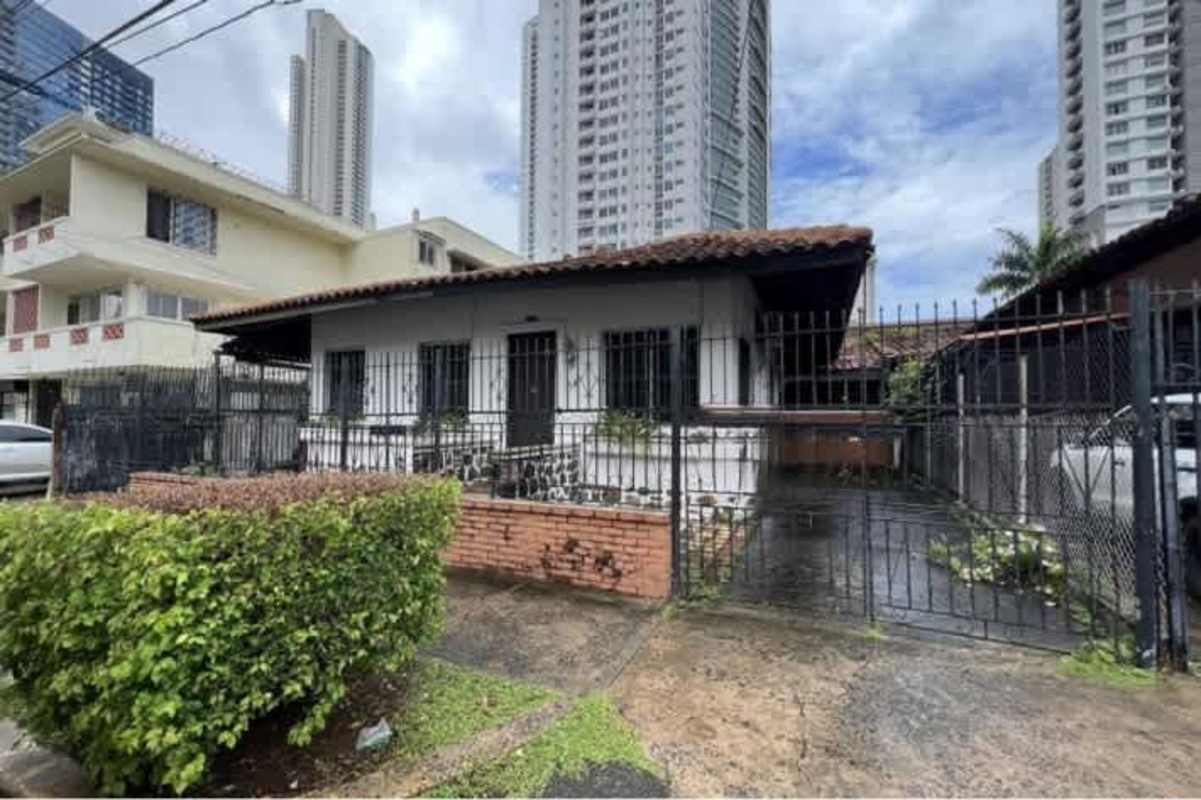 Reception open space with tiled floors, large windows and security bars in commercial house Bella Vista Panama