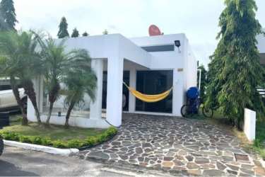 Front exterior of single-level house with garden at PH Ibiza Residences I Río Hato Panama