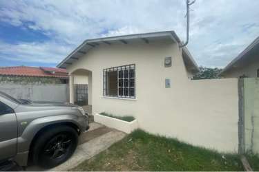 Backyard fenced yard with green areas concrete walls Villas del Llano house Penonomé Panama