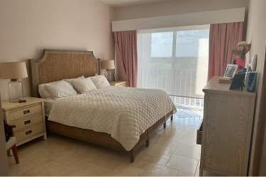 Bedroom with balcony access and ocean views in luxury PH Puntarenas penthouse Buenaventura Panama