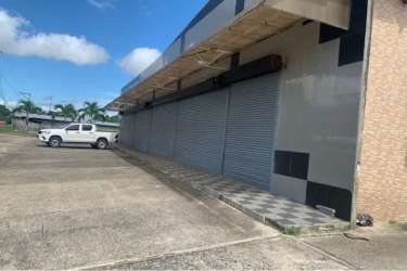 Interior large open commercial warehouse space with tiled floors and glass partitions in Costa Verde La Chorrera Panama