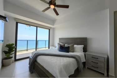 Master bedroom with private balcony facing ocean in Solaris luxury condo Panama