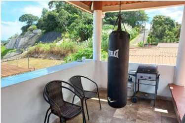 Street side view of one-story residential home Barrio Colón La Chorrera Panama