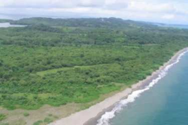 Beachfront coastline with sandy shore, ocean waves and forest Boca Brava Chiriqui