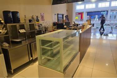 Glass showcase and coffee machines on commercial sale counter Westland Mall Panama