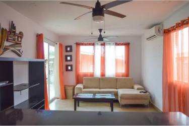 Open concept living room with bright light, tile floors and ceiling fan Coronado Panama