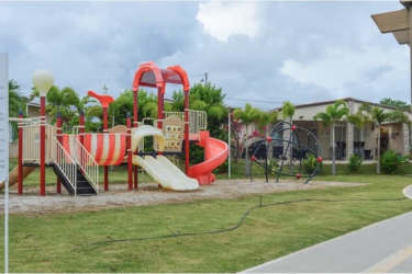 Colorful outdoor playground with palm trees in Coronado Beach Residence Panama