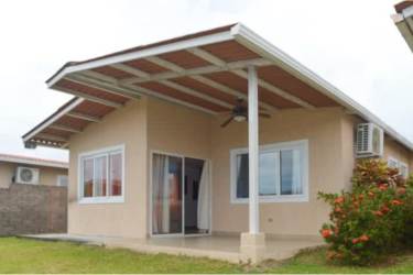 Single-story home with covered patio area and small garden in Coronado Panama