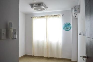 Bright living space with large window, AC unit and tiled floors Coronado Panama