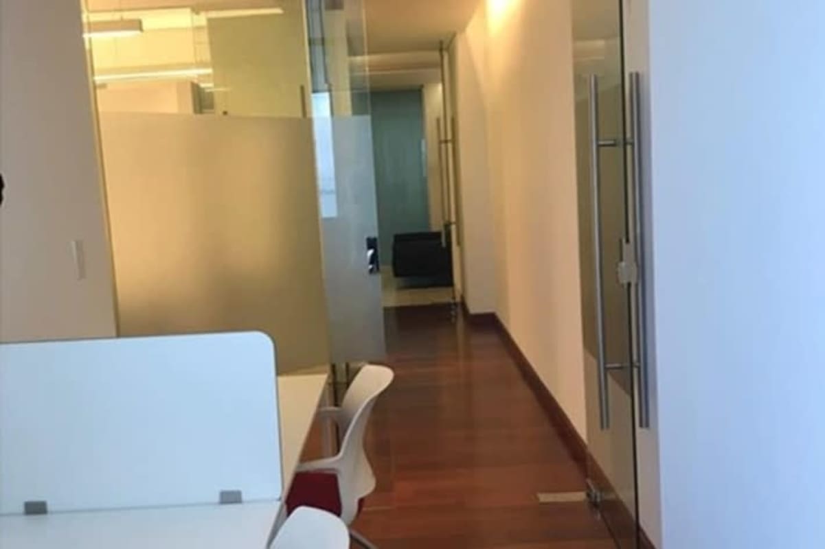 Modern reception lobby inside PH BICSA office space with black leather sofa and desk Panama