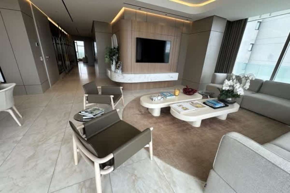 Modern Italian kitchen with marble island, built-in appliances at La Maison by Fendi Casa Santa Maria Panama