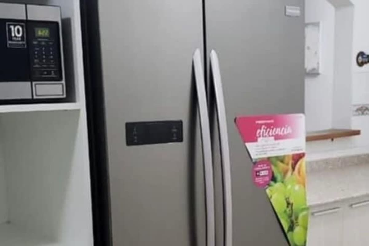 Bedroom with large window, closet, and city views in PH Portobello Panama