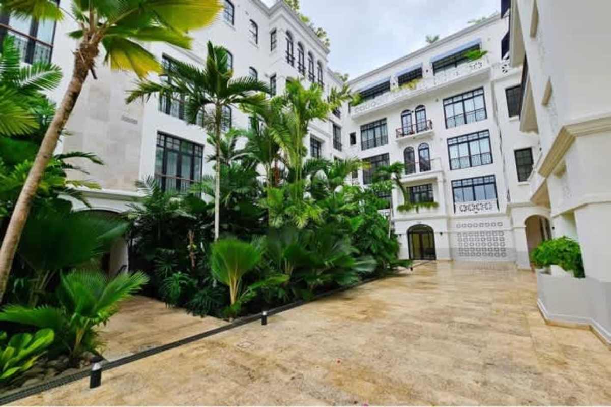 Bedroom with large windows and balcony at Santa Familia luxury condo Casco Viejo Panama City