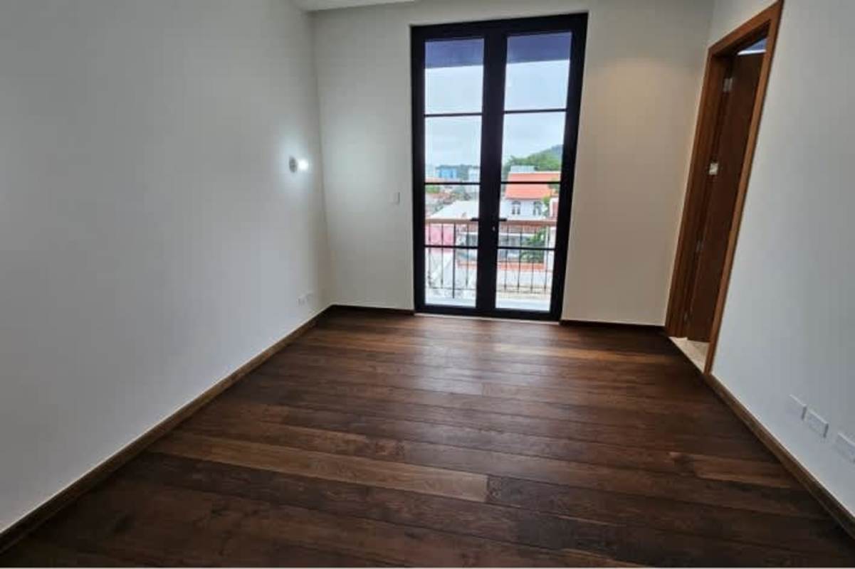 Bedroom featuring French doors to balcony in Santa Familia luxury condo Casco Viejo Panama