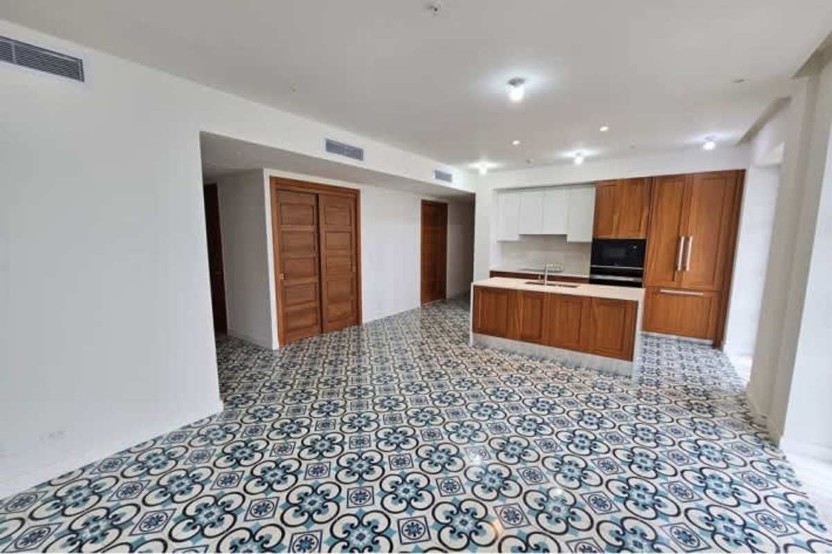 Interior hall with balcony access and ocean view in Santa Familia Panama City condo for sale