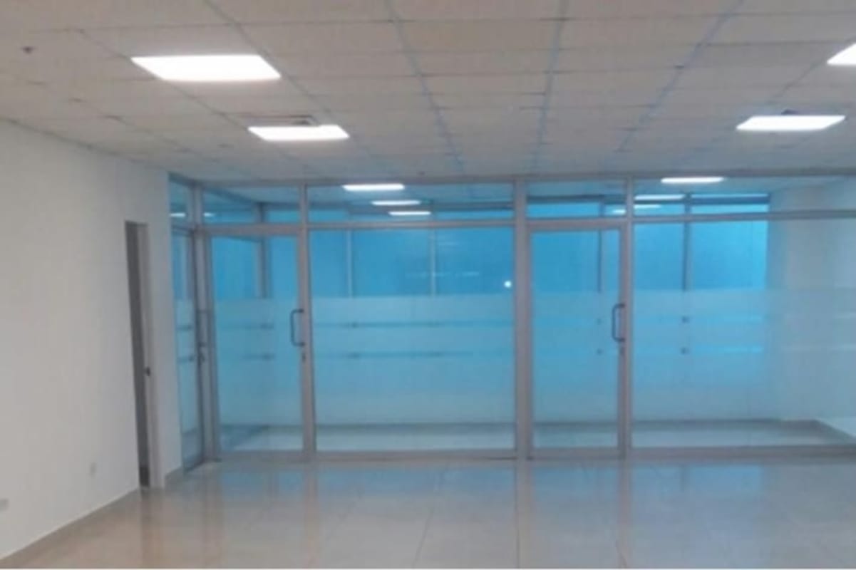 Spacious empty office with glass sliding doors and porcelain tile floor in PH BICSA Financial Center Panama