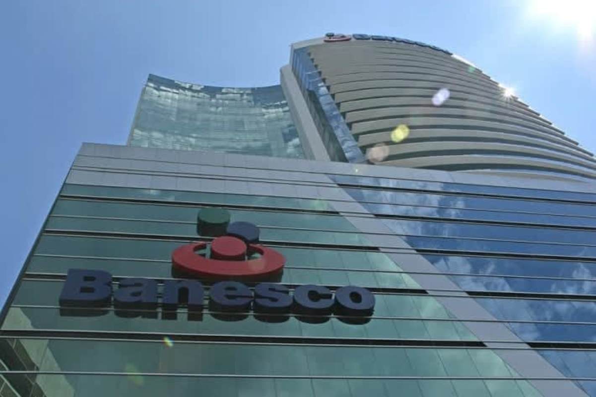 Modern glass tower with JW Marriott Panama logo and skyline reflection in Marbella Panama City