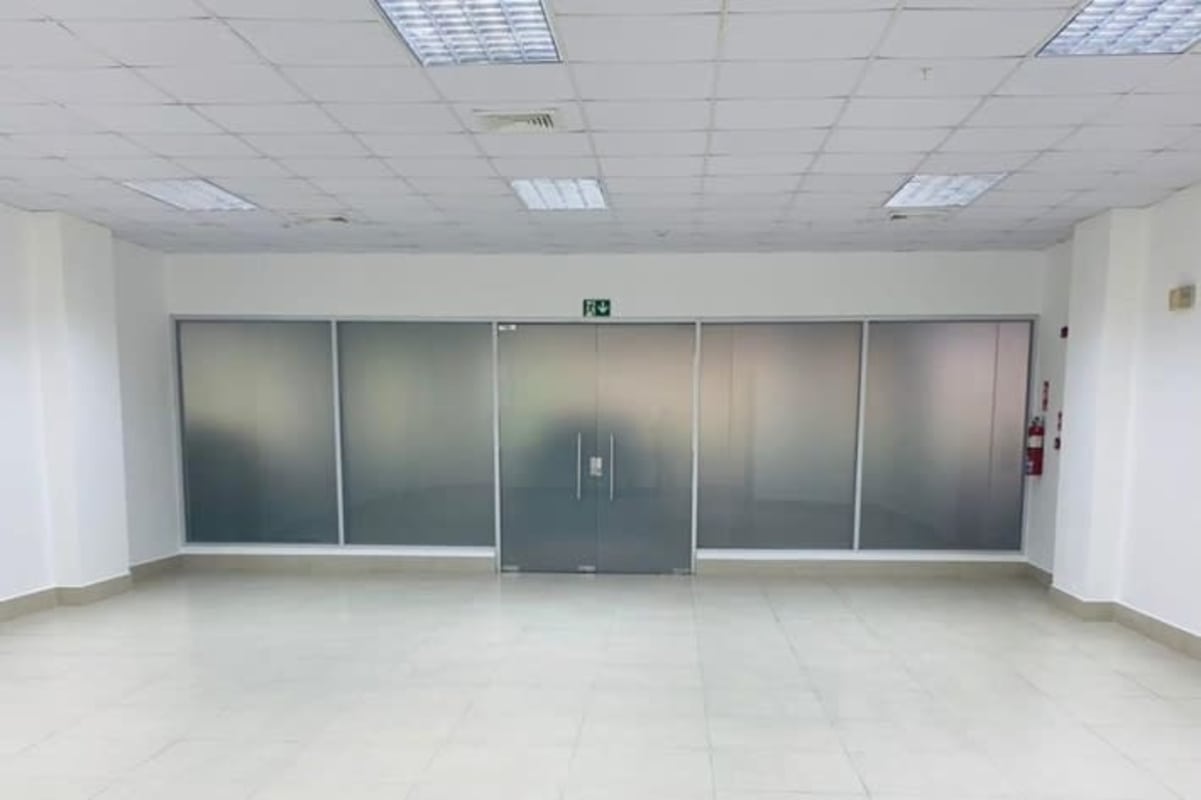 Modern commercial space with glass partitions and frosted doors in Terrazas de Albrook Panama