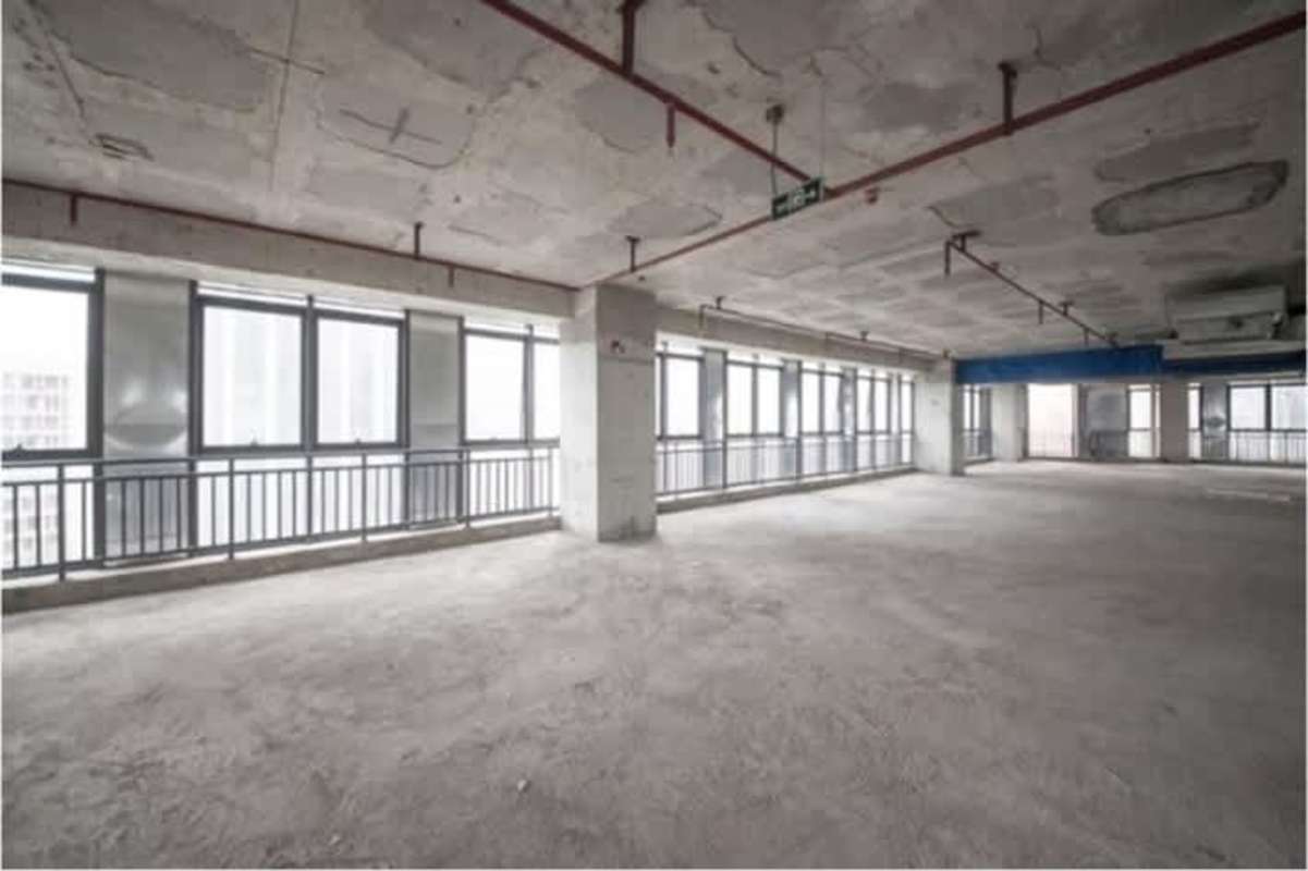 Unfinished commercial space with exposed concrete, full-height windows in PH BICSA Tower Panama City