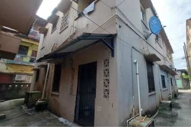 Close-up of metal door and iron window bars at Colón property Panama