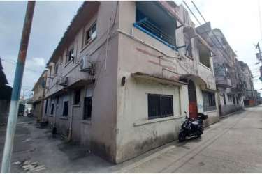 Corner view of multi-unit residential building with balconies Colón Panama