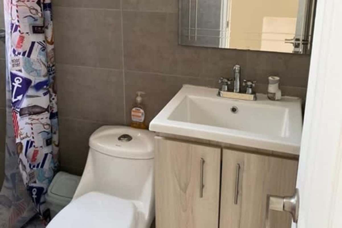 Guest powder room on ground level with toilet sink in Villa Zaita townhouse Panama