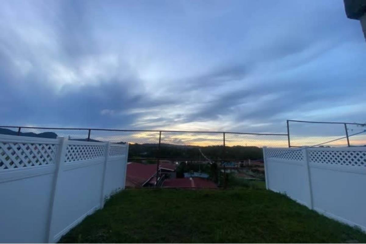 Bright living room area with staircase access in villa zaita house Panama