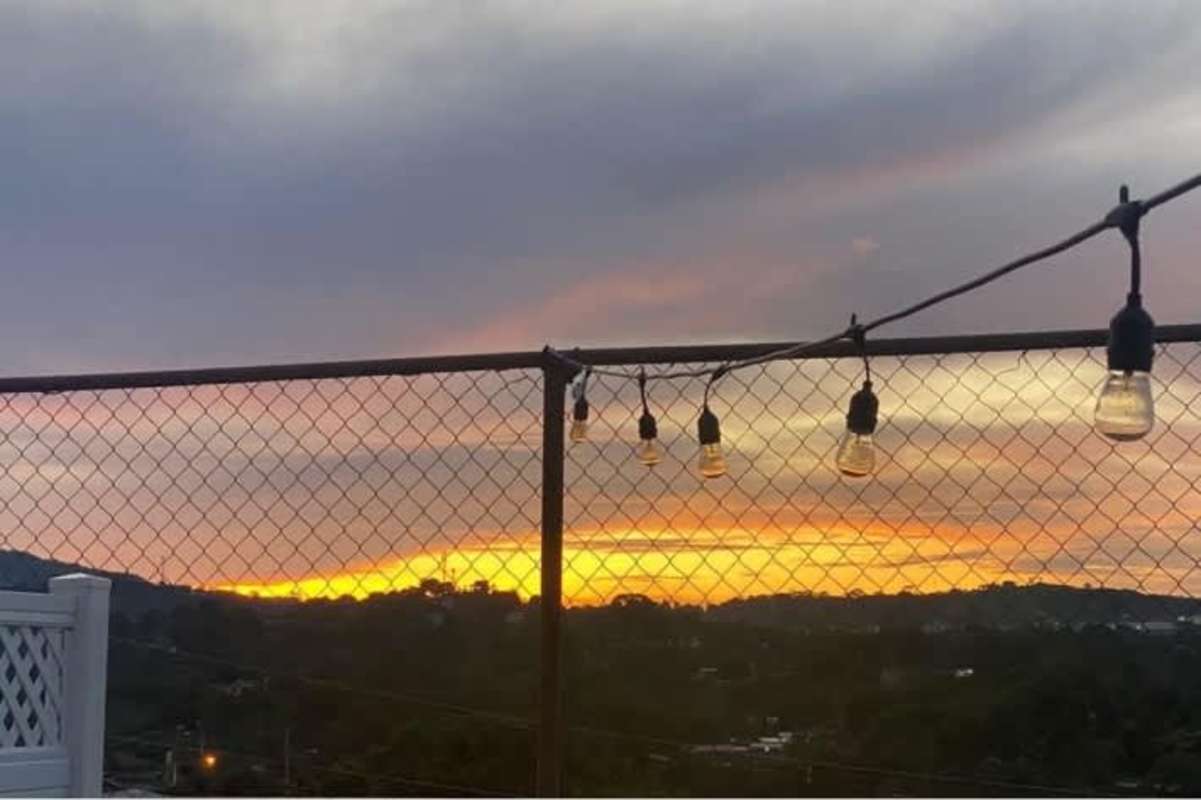 Dining area with tiled floor and window in Villa Zaita Residences house Panama