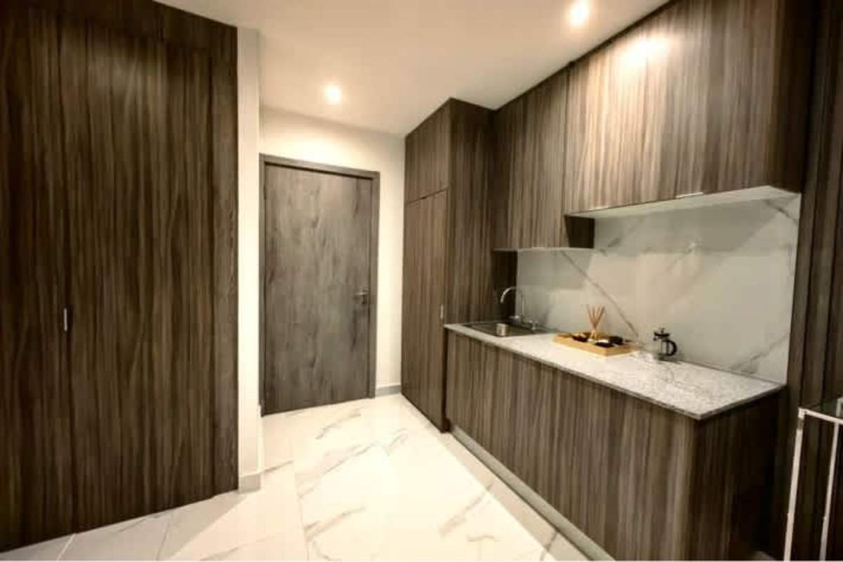 Contemporary kitchen with wood cabinetry and granite countertop PH Amazona