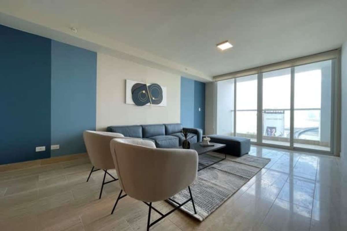 Elegant dining area with marble flooring and accent wall in PH Mahogany Panama