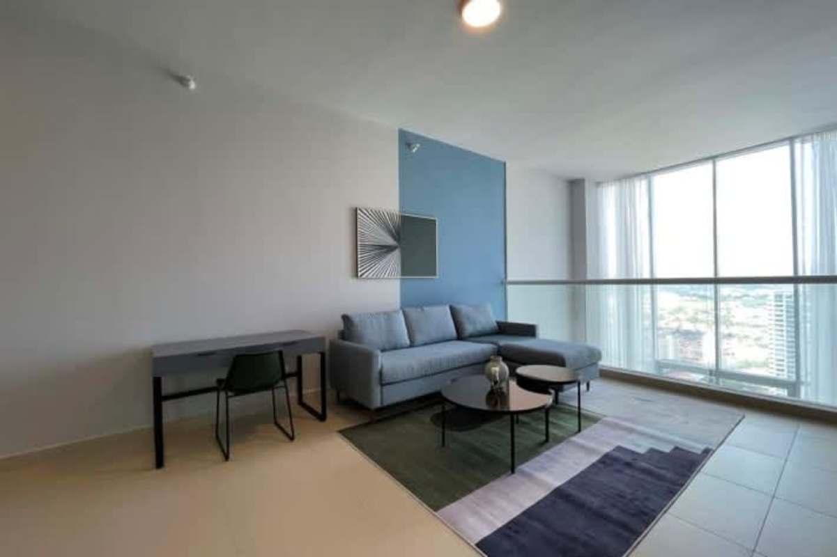 Bright bedroom with large windows and city skyline views in Costa del Este