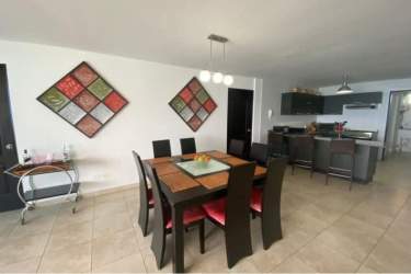 Bedroom with floor-to-ceiling sliding doors leading to balcony and Pacific Ocean view PH Coronado Panama