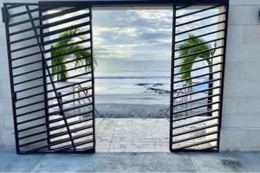 Contemporary entrance gate leading to beachfront resort at PH Coronado Country Club