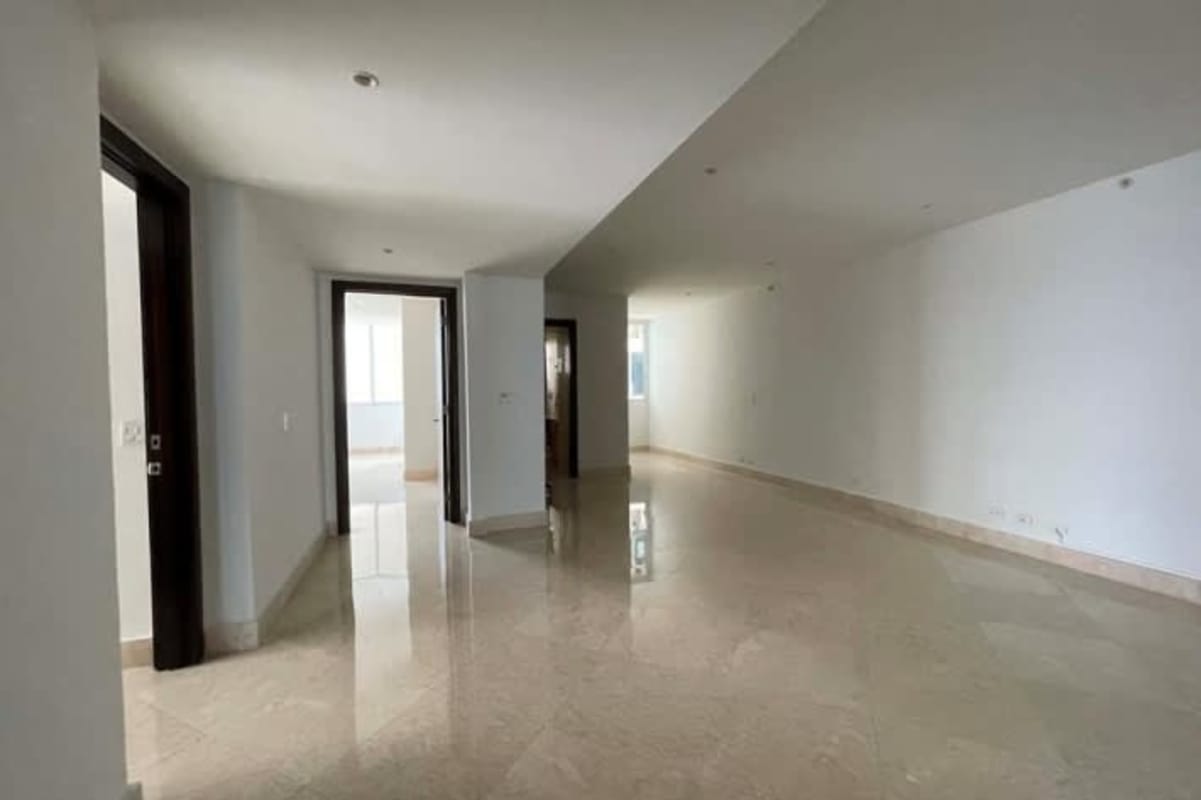 Spacious marble bathroom with double sinks, bathtub, and city skyline views at PH The Point Punta Paitilla Panama