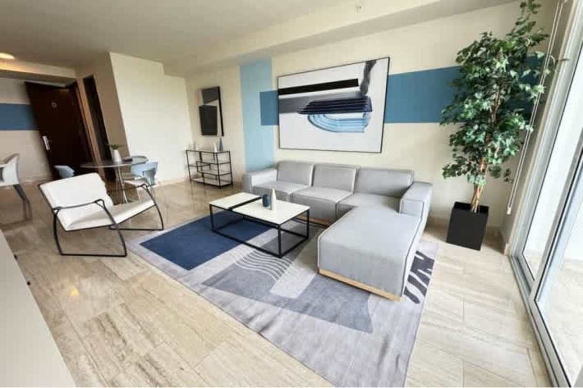 Spacious open layout living dining with marble flooring large windows ocean view at PH Mirador Costa del Este Panama