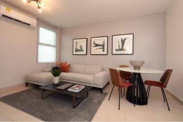 Modern living area with large windows and private balcony in Parterre Panama Pacifico apartment