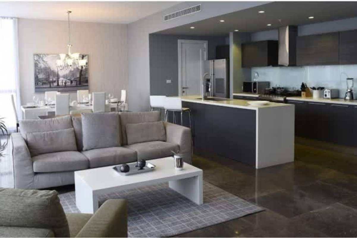 Modern kitchen with granite countertops large island stainless appliances Yoo Panama Arts Tower