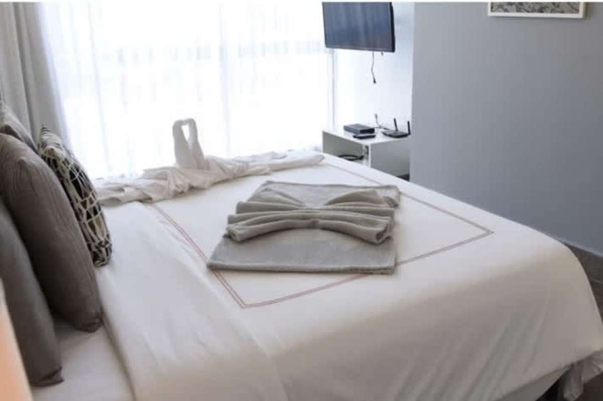 Modern open plan dining living area city skyline views Yoo Panama Panama City