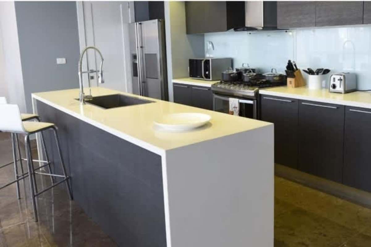 Spacious bedroom suite panoramic floor-to-ceiling windows city waterfront views Yoo Panama Arts Tower