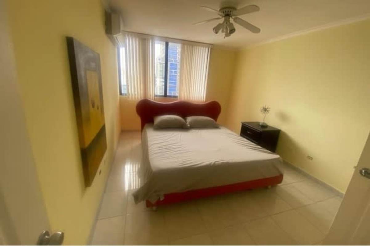 Bedroom with city view large window ceiling fan AC PH Terrazas del Cangrejo Panama