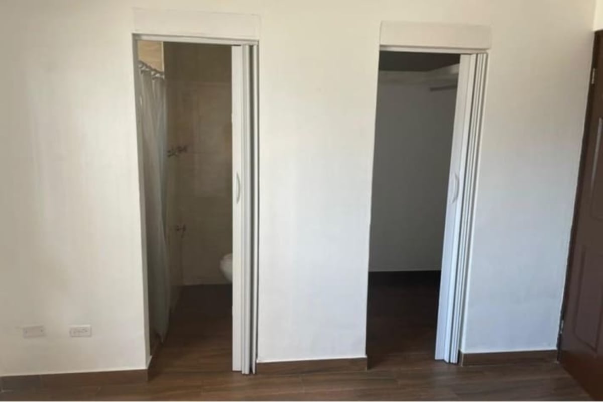 Compact modern bathroom with shower in Condado Country Club Condado del Rey Panama